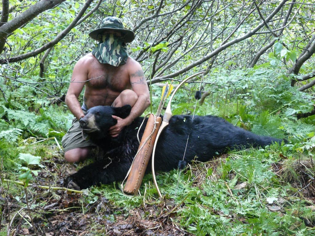 Traditional bow hunting — black bear taken with a primitive bow